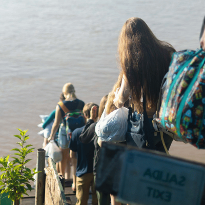Participants in Peru pack up their things and head towards their boat